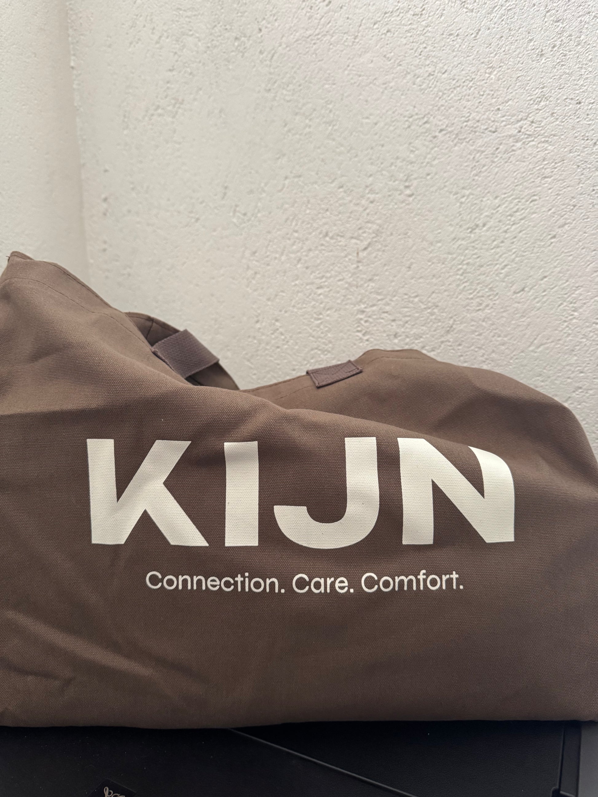 Deep chocolate brown tote with oversized sweaters for leggings