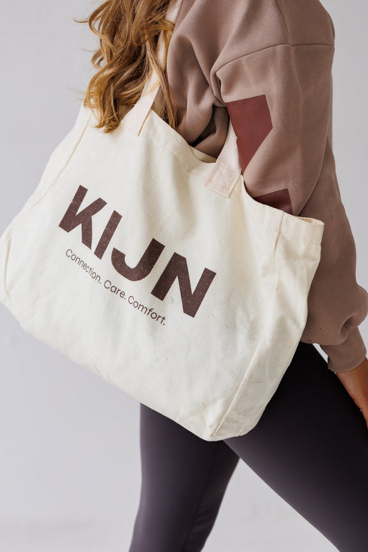 Unaltered neutral tote bag styled with womens soft leggings, KIJN