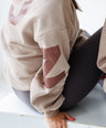 Model wearing KIJN Kori Comforter Oversized Sweatshirt, paired with KIJN Second Skin Unaltered Leggings for a relaxed, comfortable look.
